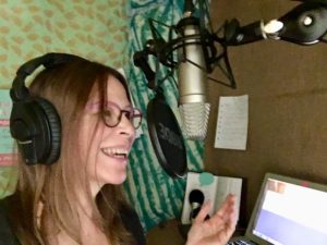 Phebe Phillips recording a podcast